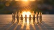 © Anhidrit'12 - Wooden figures holding hands in a circle around a glowing heart at sunset representing unity love and community support