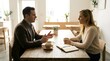 © pkproject - A young couple is engaged in a relaxed conversation over coffee at a charming cafe table highlighting a moment of connection and shared enjoyment within a warm inviting interior environment