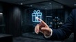 © MSTMAYA - A business person touching a glowing digital gift box hologram in a dark office environment representing rewards, bonuses, or special offers