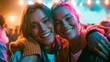 © Justlight - Two stylish women sharing a joyful hug backstage at a pop concert, bright stage lights and haze behind them, excited mood, colorful neon lighting, candid mid-shot composition.
