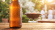 © Aurora Aesthetics - cold beer bottle condensation summer heat refreshment glass beverage patio showing droplets on amber glass for adult drink advertising backyard leisure and hot day relaxation themes