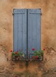 © KIMOG - Old Window with Open Blue Wooden Shutters on Rustic European House Facade