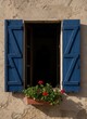 © KIMOG - Old Window with Open Blue Wooden Shutters on Rustic European House Facade