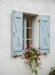 © KIMOG - Old Window with Open Blue Wooden Shutters on Rustic European House Facade