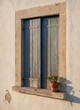 © KIMOG - Old Window with Open Blue Wooden Shutters on Rustic European House Facade