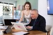 © JackF - Woman help an older manager learn to use a laptop