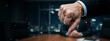 © Hamza - Businessman's Hand Giving Thumbs Down Gesture in Dark Office Setting