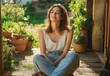 © Milana - young woman with face blurred sitting cross-legged on a sunlit wooden porch surrounded by potted plants, wearing a white tank top and jeans, relaxed and peaceful