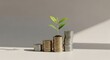 © David - Green plant growing from coin stacks.