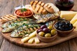 © Lubos Chlubny - Grilled sardines tapas platter with olives and cheese