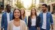 © KangDidik - Diverse group of young adults walking.