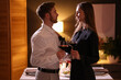 © New Africa - Date. Lovely couple with glasses of red wine at home