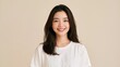 © Punnn - Serene Smile: A young Asian woman with a warm and genuine smile, her long dark hair framing her face, radiates a sense of calm confidence and approachability.