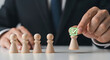 © Maidul - Businessman selects person with green checkmark from group on table