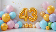 © SHAJEDA - Bright forty three golden number balloons celebration with colorful pastel bubbles and confetti.