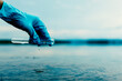 © sawitreelyaon - Scientist collecting water sample to monitor pollution and environmental quality.