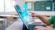 © Saqlain - a young student touching ai assistance hologram coming out from the laptop screen, in a modern classroom, ai assistance holograph on the screen, ai technology in schools and education concept