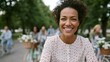 © progressman - Happy woman in park with bicycles and blooming white flowers