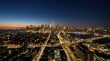 © Mey - A stunning nighttime panoramic view of New York City. The iconic One World Trade Center dominates the skyline, surrounded by a dense collection of skyscrapers and illuminated streets.