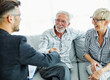 © Lumos sp - Happy senior old family couple clients make financial insurance estate business deal handshake agent lawyer, satisfied mature customers shake hand meeting bank manager agree on investment contract