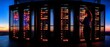 © rashyn - Massive server cluster at sunset.  A technician works among illuminated racks