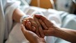 © Ganesha88 - Extreme Close Up Of Caring Hands Of A Healthcare Worker Providing Comfort And Support To A Patient In A Hospital Setting