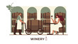 © EmilyGrace - Elegant winery interior with a professional worker moving a wooden barrel on a cart and a woman tasting red wine.