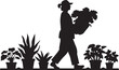 © Tarek - Silhouette of a person carrying a plant, walking past