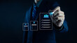 © loechai - Businessman holding digital human resource icon with employee profiles, symbolizing recruitment, HR management, staff selection, corporate workforce strategy, and human capital development in modern.