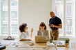 © BONNINSTUDIO/Stocksy - Collaborative diverse team working in bright office