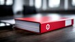 © Neon Stock - Red office binder with checklist logo on wooden desk