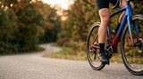 Professional Cyclist Riding a Performance Road Bike on a Scenic Forest Path at Sunset