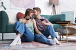 © New Africa - Date. Couple with glasses of wine listening to vinyl record at home