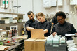 © Maskot - Group of chefs taking inventory while working in commercial kitchen