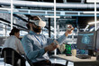 © DC Studio - System administrator uses a VR headset to inspect AI neural networks and server systems in a high-tech facility.