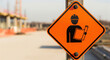 © Hammad - Orange construction site sign with worker icon, industrial safety warning board, building project site development concept