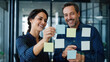 © 123sasha - Business people planning with sticky notes on glass wall