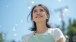 © s - 青空とシャボン玉を見上げて微笑む爽やかなエプロン姿の若いアジア人女性 AI generated｜女性、笑顔、エプロン、青空、シャボン玉、ライフスタイル、希望