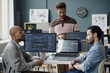 © Seventyfour - Multiethnic young adult men discussing software development workflow in information technology office, reviewing code and analytics dashboards. Ideal for teamwork, coding, startup marketing