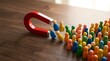 © mcjanuald - Red horseshoe magnet attracting colorful wooden peg dolls on wooden table, customer acquisition and inbound marketing concept