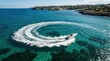 © RONNY - Aerial View of Speedboat Creating a Swirling Wake on Turquoise Water.