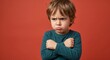 © Olena Apetroaiei - Grumpy little kid with a pensive frown and tousled hair in a vibrant studio setting