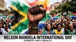 © KUMADARA SURESHBHAI  - Powerful raised fist with south african flag colors celebrating nelson mandela international day unity