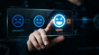 © designer rofiqul - Hand touching happy and unhappy emoticons on screen