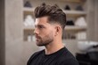© Mustafa Kawa - Stylish man with a modern pompadour haircut and groomed beard in a professional barbershop setting