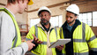 © peopleimages.com - Discussion, tablet and men in warehouse for woodwork, manufacturing and contractor team. Furniture, production and carpenter people in joinery factory with tech for workshop, collaboration or project