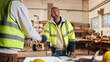 © peopleimages.com - Carpenter, man and shaking hands in factory for greeting, manufacturing collaboration or deal. Woodwork, smile and handshake with people in workshop for welcome, joinery production and partnership
