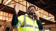 © peopleimages.com - Carpenter, black man and phone call in factory for manufacturing negotiation, feedback or planning. Mobile, woodwork and mature person with update, joinery production and lumber order for supply