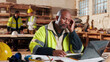 © peopleimages.com - Carpentry, man and headache in workshop with laptop, exhausted or mistake in supply order. Project planning, tech or mature carpenter in woodworking factory with migraine, stress or deadline pressure