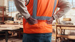 © peopleimages.com - Carpenter, hands and back pain in workshop with burnout, fatigue or repetitive stress injury in industry. Project manager, tired or man in woodworking factory with physical strain or muscle stiffness